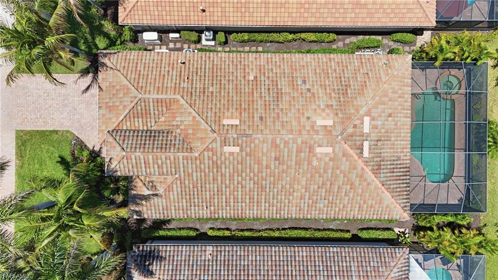 3058 Aviamar Circle Naples, FL 34114 - Photo 32 of 50 Terracotta tile roof with hip and valley lines