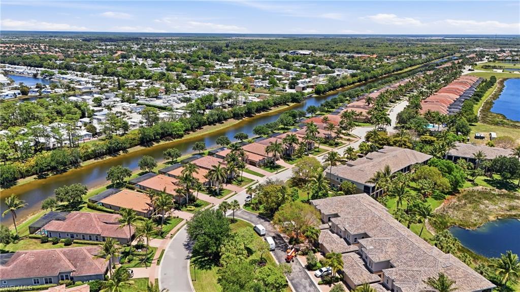 3058 Aviamar Circle Naples, FL 34114 - Photo 35 of 50 Aerial perspective showcasing a residential community with abundant green landscaping