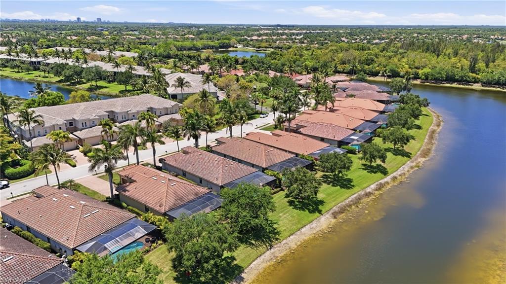 3058 Aviamar Circle Naples, FL 34114 - Photo 36 of 50 Aerial view of a residential community featuring waterfront properties with access to a large body of water