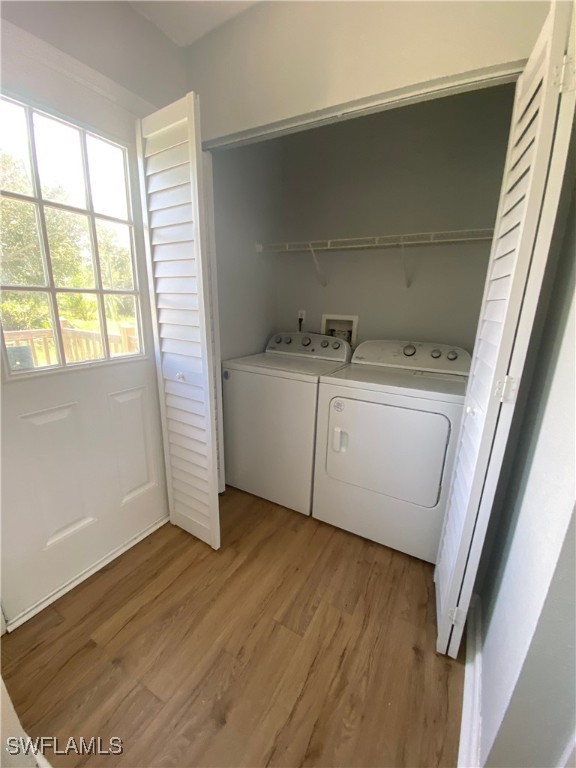 5527 Judith Road Bokeelia, FL 33922 - Photo 11 of 13 a view of an empty room with wooden floor and a window