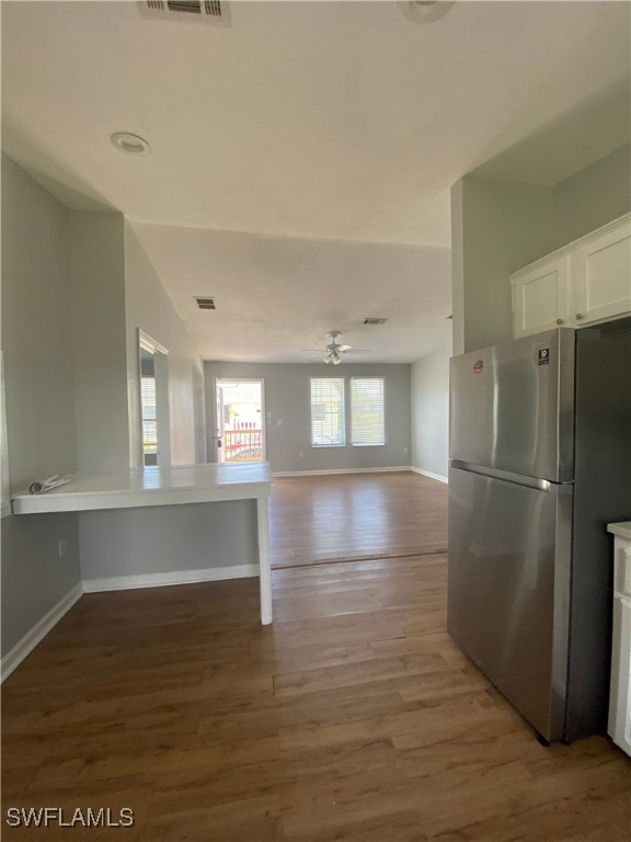 5527 Judith Road Bokeelia, FL 33922 - Photo 7 of 13 a view of empty room with wooden floor and window