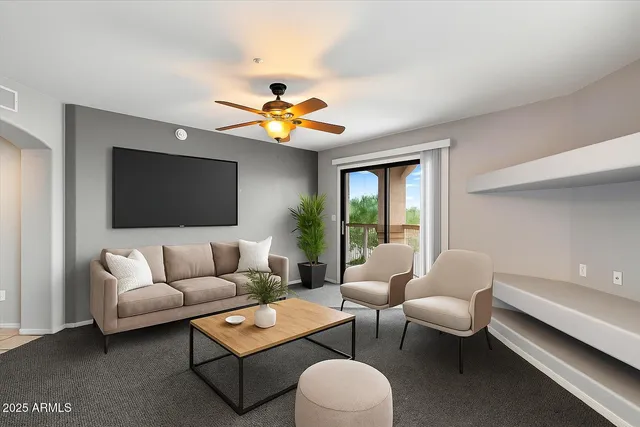 a living room with furniture and a flat screen tv