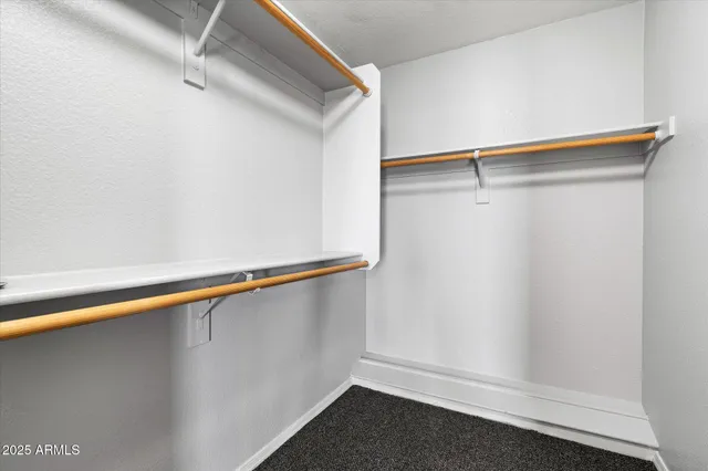 a view of an empty walk in closet