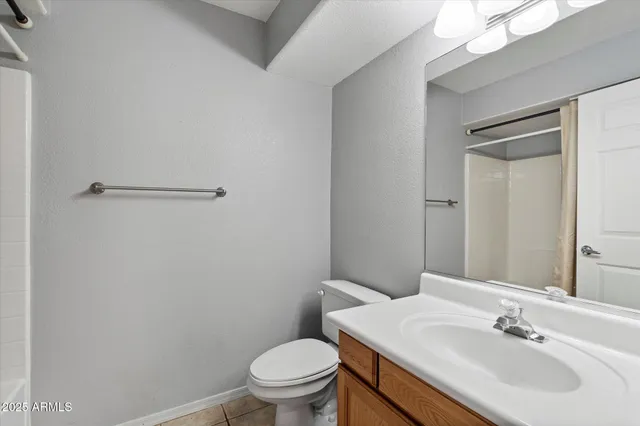 a bathroom with a sink toilet and vanity