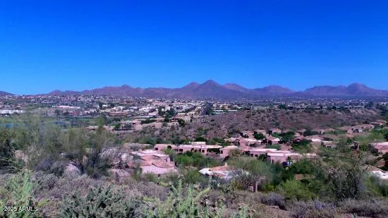 a view of a city with mountains in the background