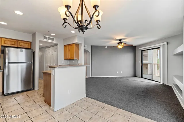 a view of entryway and kitchen