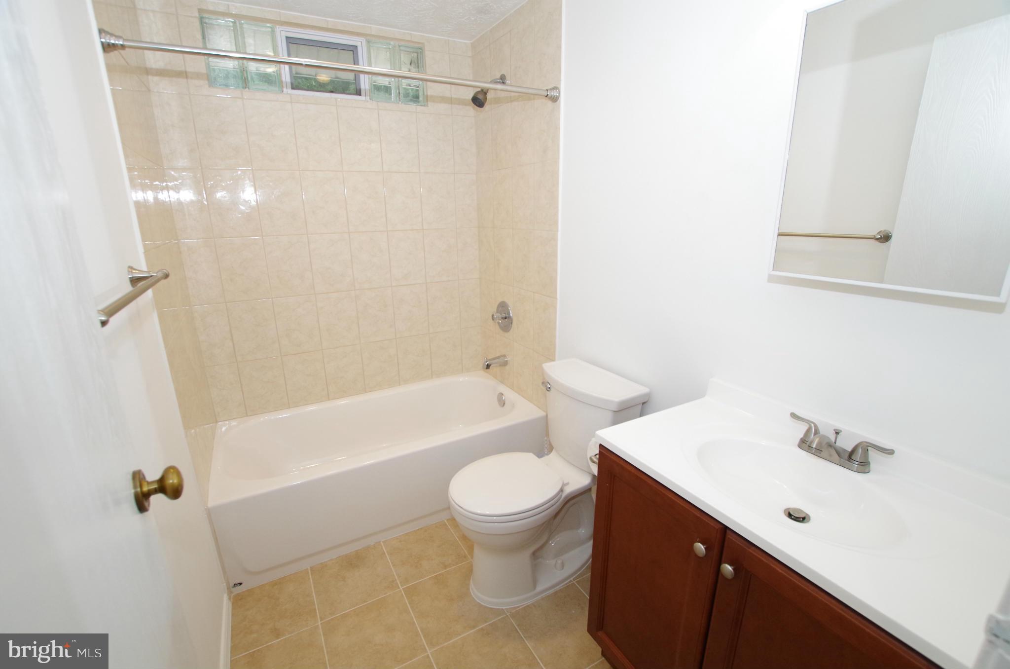7312 Torran Rocks Way Gaithersburg, MD 20879 - Photo 14 of 30 Remodeled Bathroom with New Tile