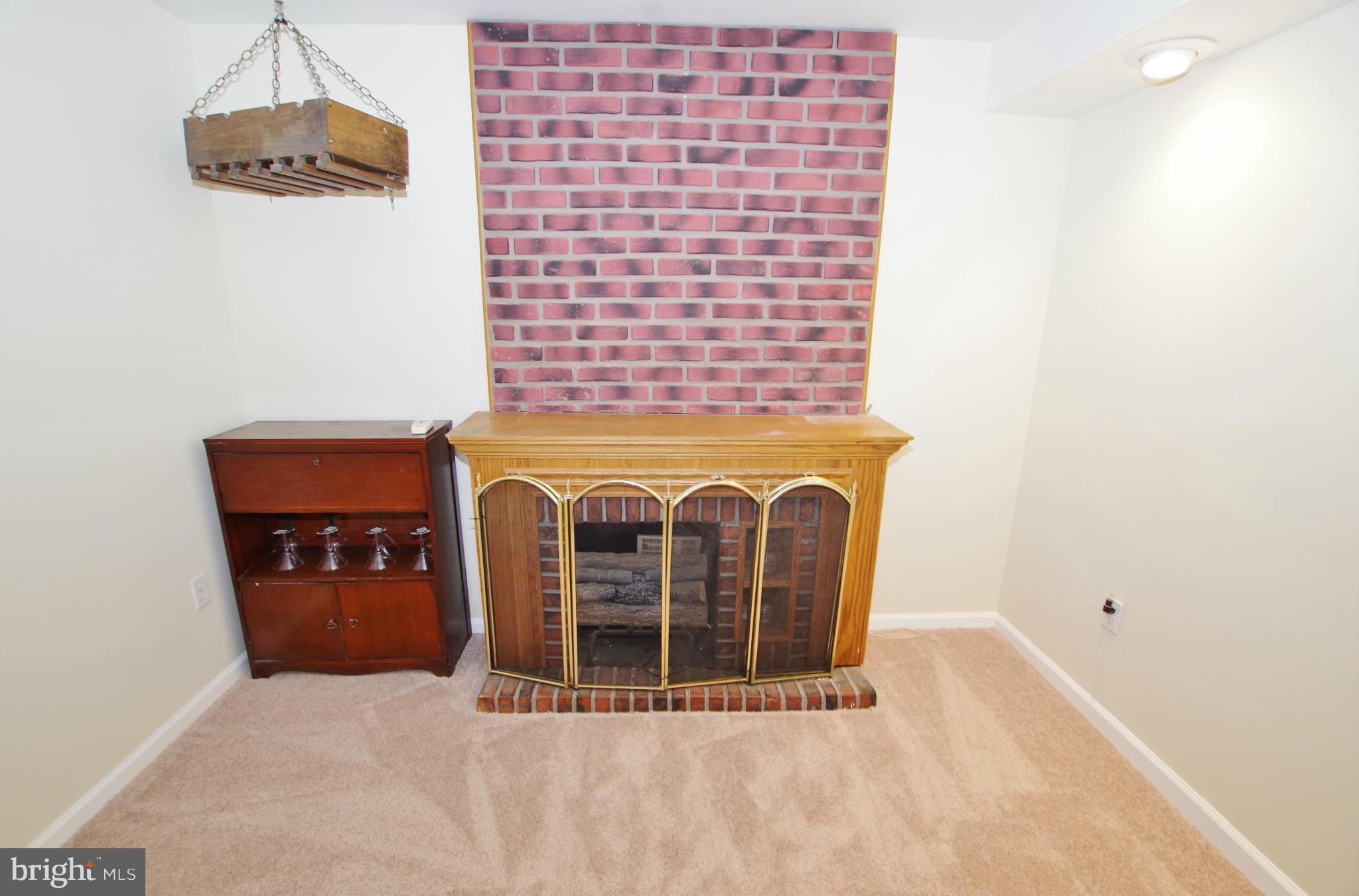 7312 Torran Rocks Way Gaithersburg, MD 20879 - Photo 16 of 30 Recreation Room Fireplace