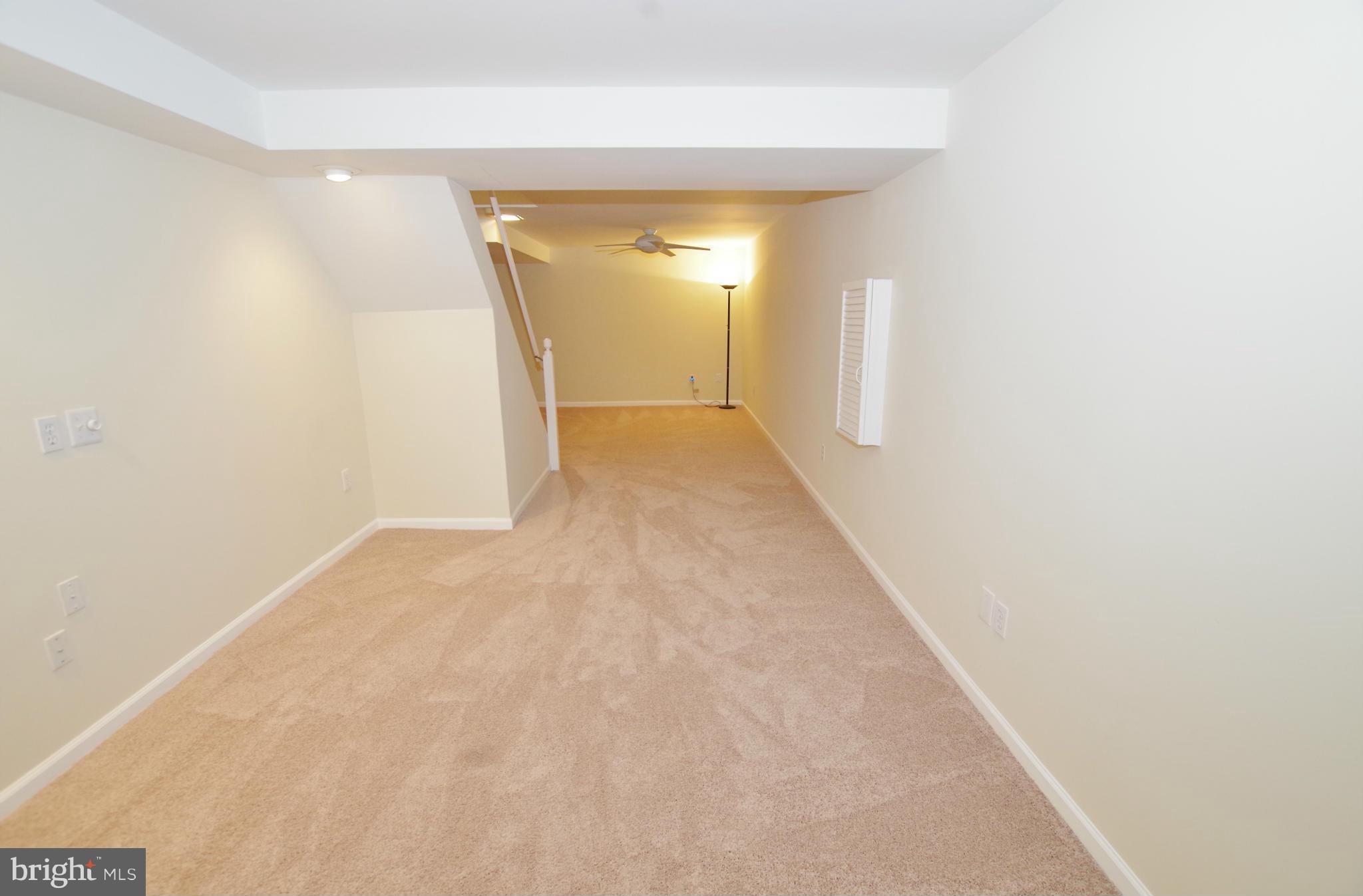 7312 Torran Rocks Way Gaithersburg, MD 20879 - Photo 17 of 30 Recreation Room with New Carpet