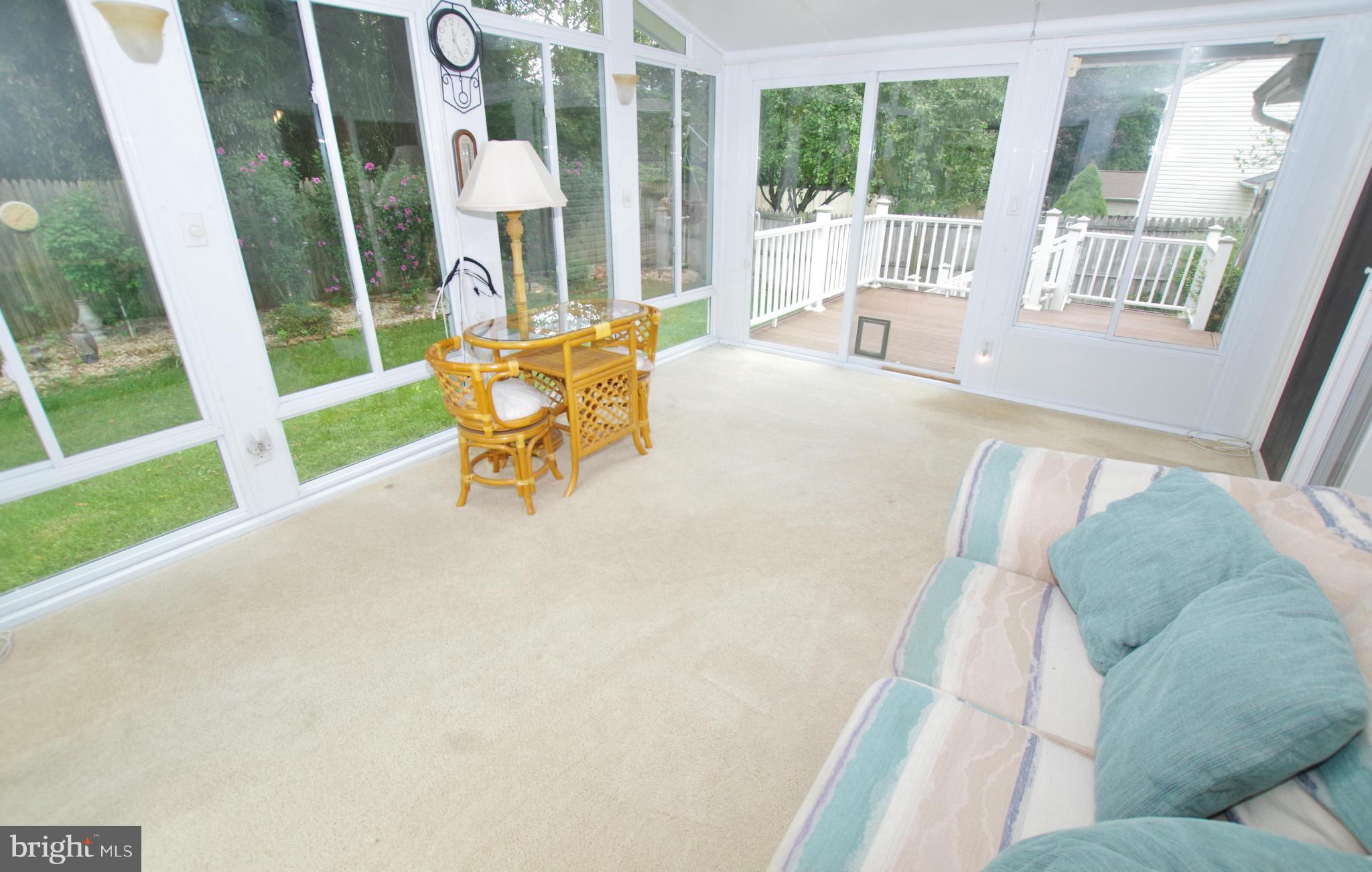 7312 Torran Rocks Way Gaithersburg, MD 20879 - Photo 22 of 30 Sunroom with Ceiling Fan and Skylights