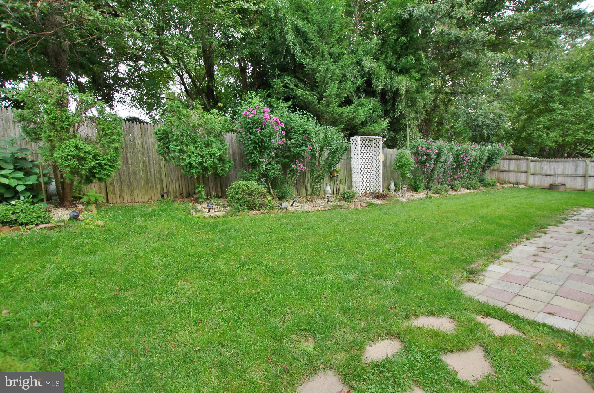 7312 Torran Rocks Way Gaithersburg, MD 20879 - Photo 26 of 30 View of Backyard Landscaping and Fence