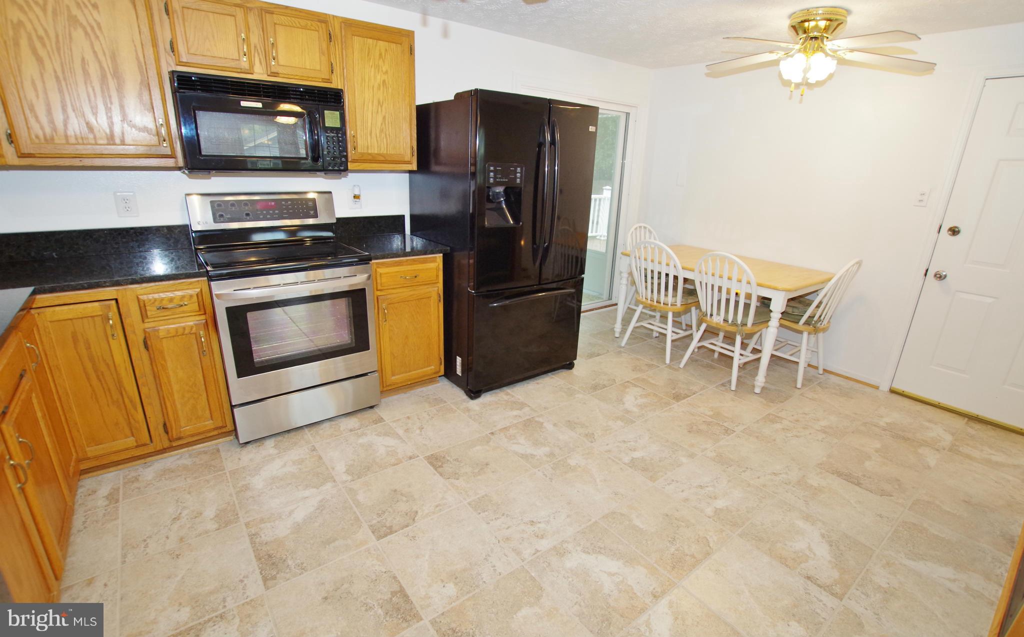 7312 Torran Rocks Way Gaithersburg, MD 20879 - Photo 10 of 30 Ceramic Tile Floor and Ceiling Fan