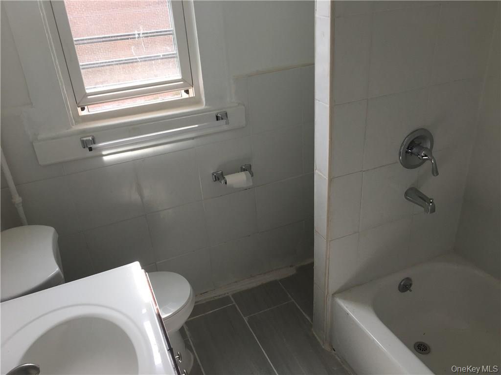 14 Horton Avenue New Rochelle, NY 10801 - Photo 11 of 29 a bathroom with a toilet and a shower