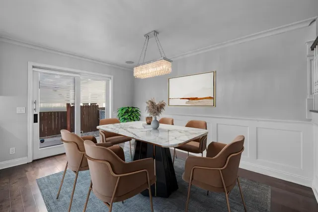 a view of kitchen with cabinets and wooden floor