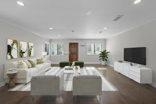 a kitchen with granite countertop a sink cabinets and wooden floor