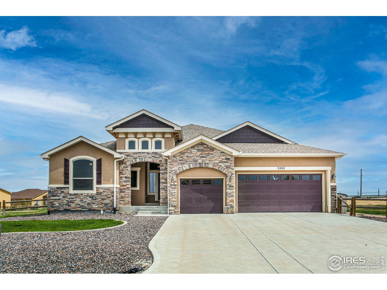 3202 Timeless Circle Berthoud, CO 80513 - Photo 1 of 40 a front view of a house with a garden and yard