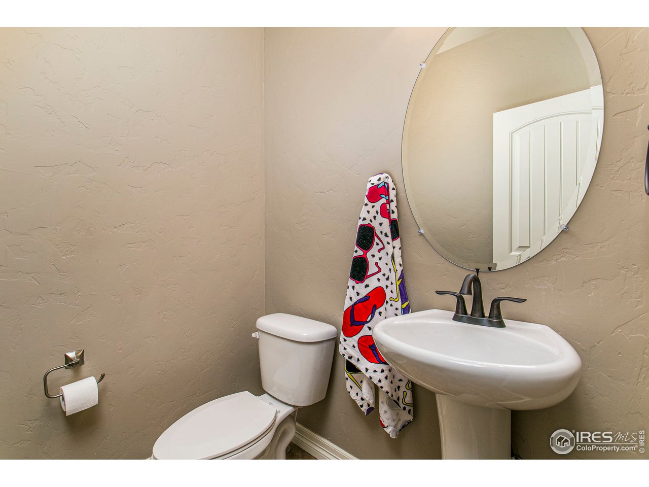 3202 Timeless Circle Berthoud, CO 80513 - Photo 17 of 40 a bathroom with a sink and a toilet