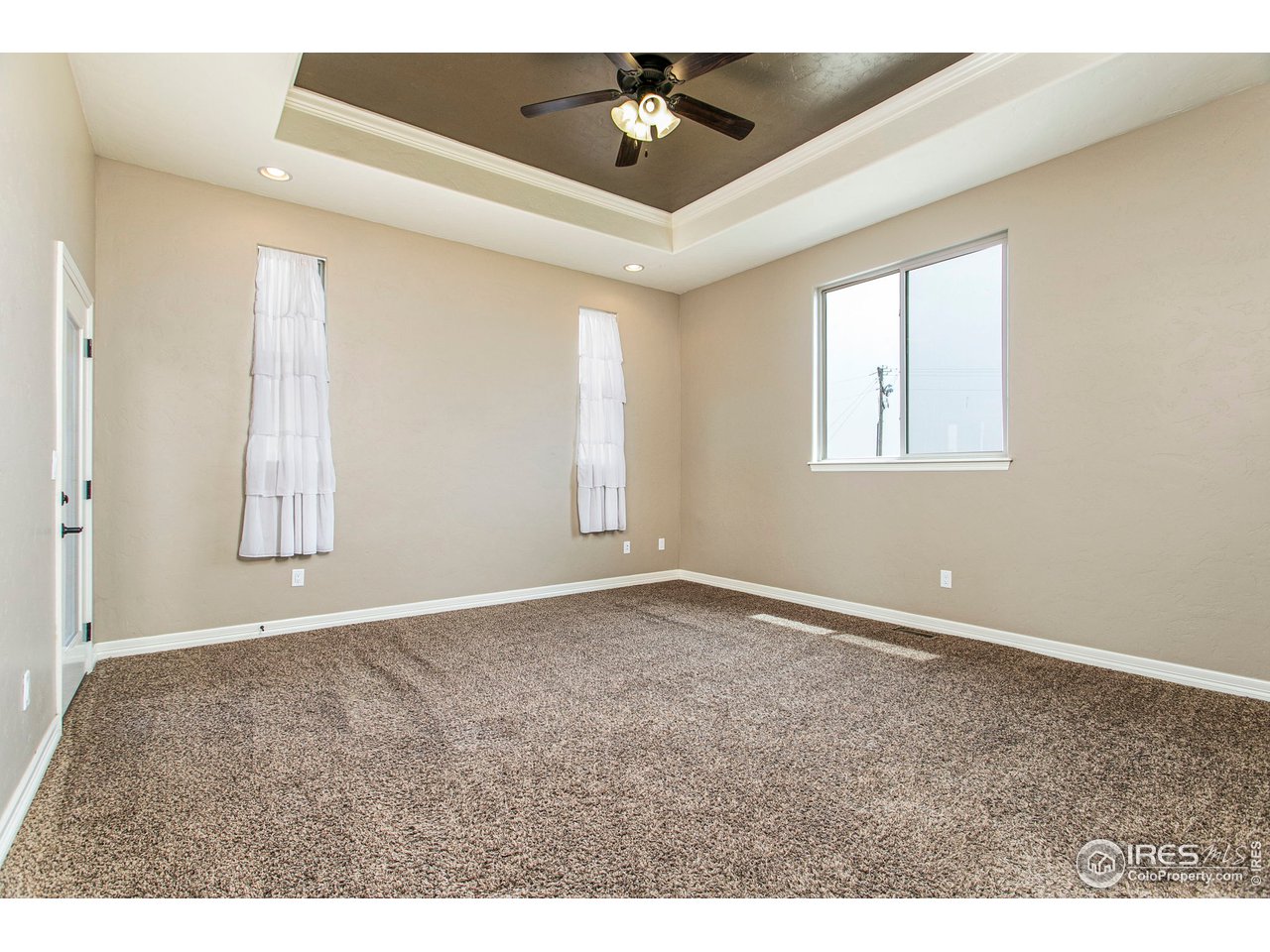3202 Timeless Circle Berthoud, CO 80513 - Photo 19 of 40 a view of an empty room with a window
