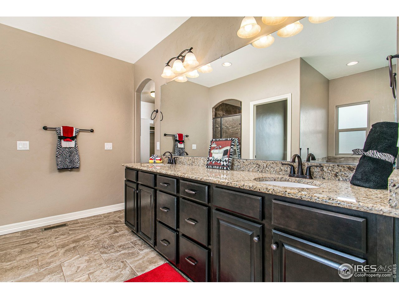 3202 Timeless Circle Berthoud, CO 80513 - Photo 22 of 40 a bathroom with a sink and a mirror