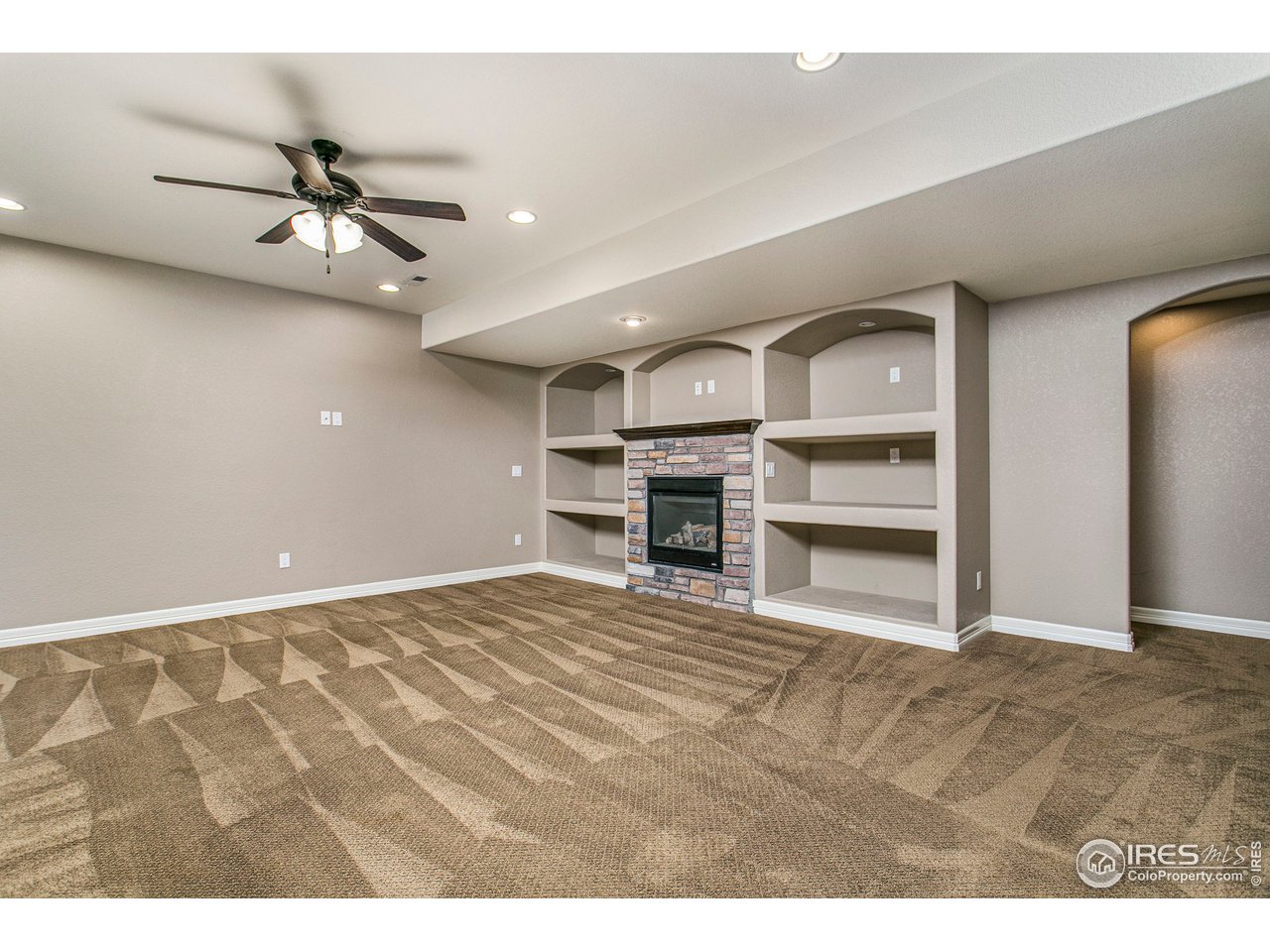 3202 Timeless Circle Berthoud, CO 80513 - Photo 24 of 40 a view of a livingroom with furniture and a ceiling fan