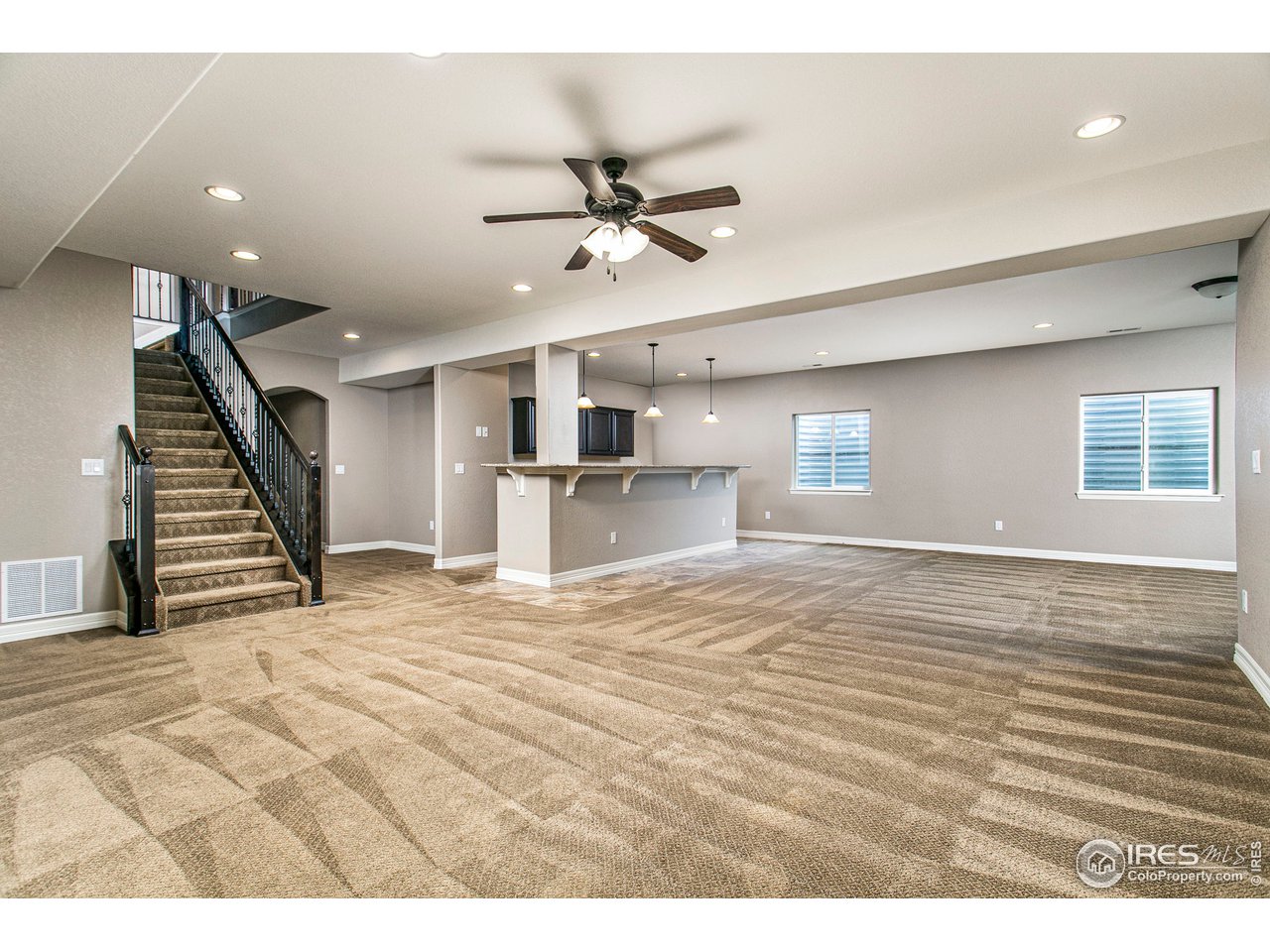 3202 Timeless Circle Berthoud, CO 80513 - Photo 25 of 40 a view of empty room with wooden floor and ceiling fan