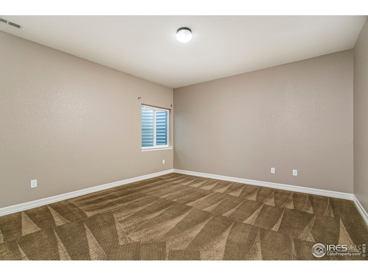 3202 Timeless Circle Berthoud, CO 80513 - Photo 29 of 40 a view of an empty room with a window