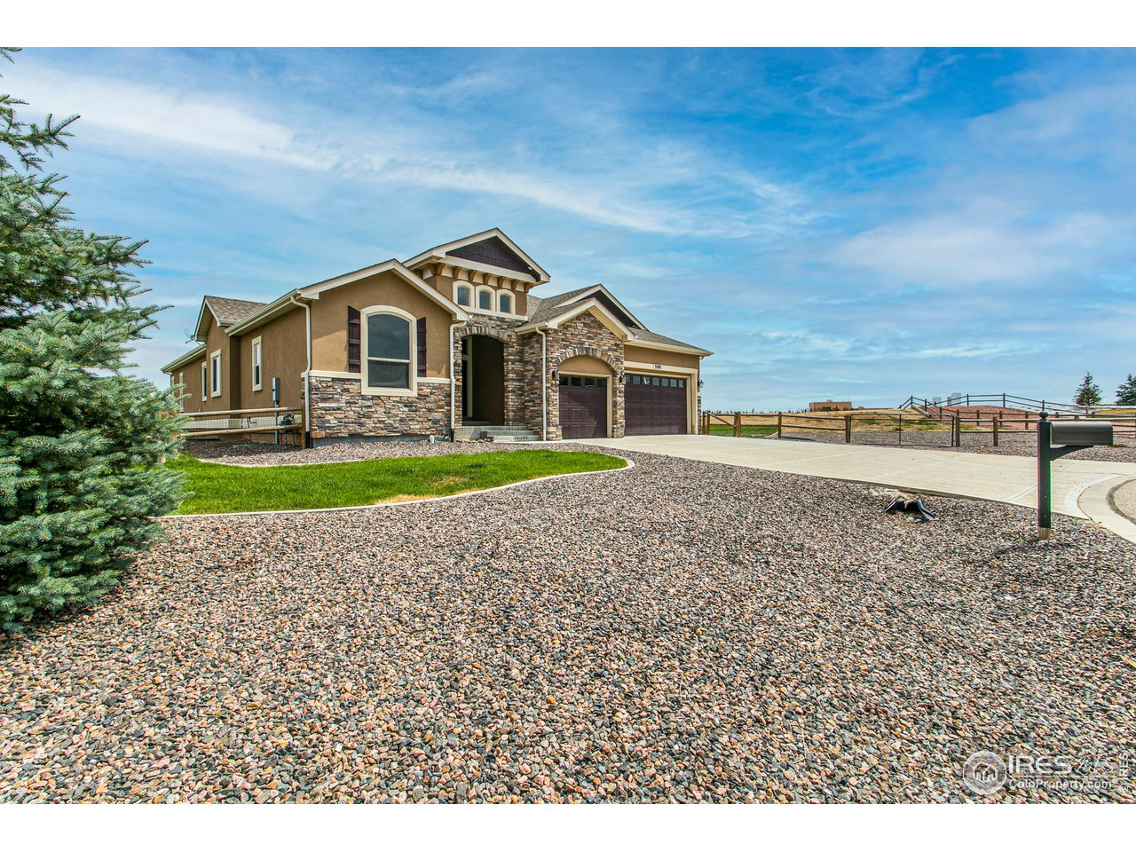 3202 Timeless Circle Berthoud, CO 80513 - Photo 3 of 40 a front view of a house with a yard
