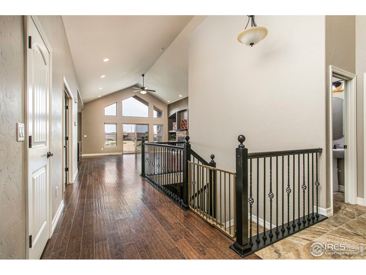 3202 Timeless Circle Berthoud, CO 80513 - Photo 9 of 40 a view of a hallway with wooden floor