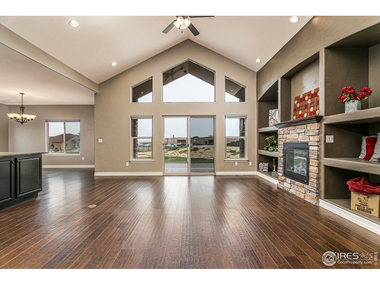 3202 Timeless Circle Berthoud, CO 80513 - Photo 10 of 40 a view of an empty room with wooden floor and a window