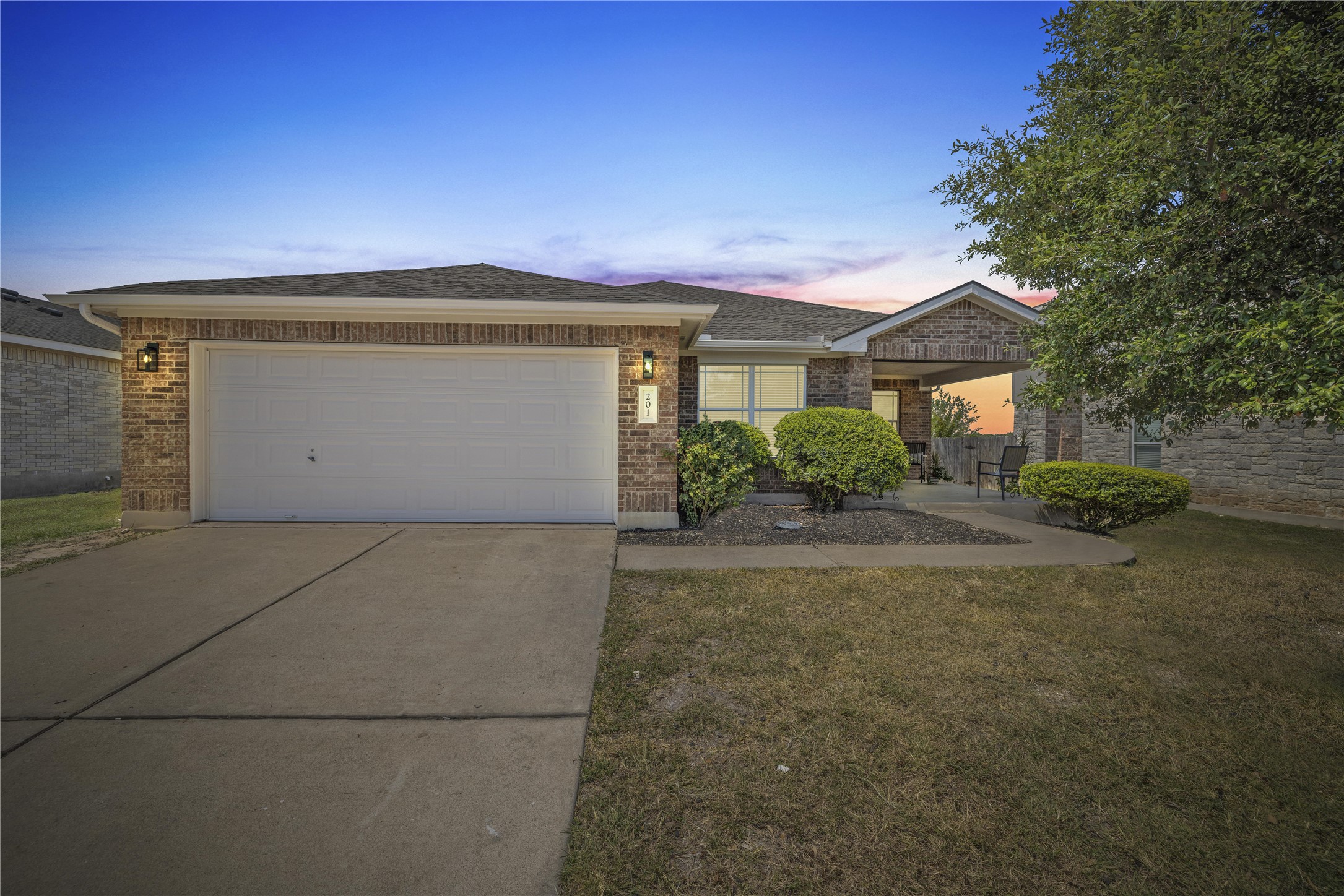 201 Katherine Way Leander, TX 78641 - Photo 1 of 1 a front view of a house with a yard and garage