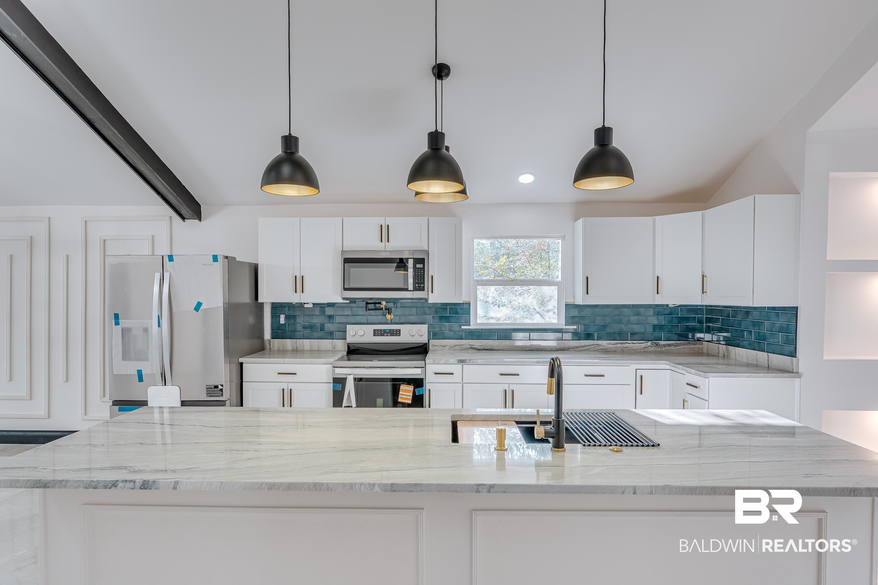 1190 Military Road Mount Vernon, AL 36560 - Photo 7 of 47 Kitchen with appliances with stainless steel finishes, light stone countertops, white cabinets, decorative light fixtures, and tasteful backsplash