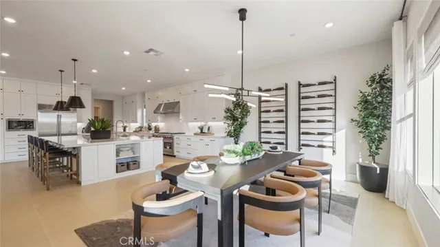 a kitchen with a table and chairs