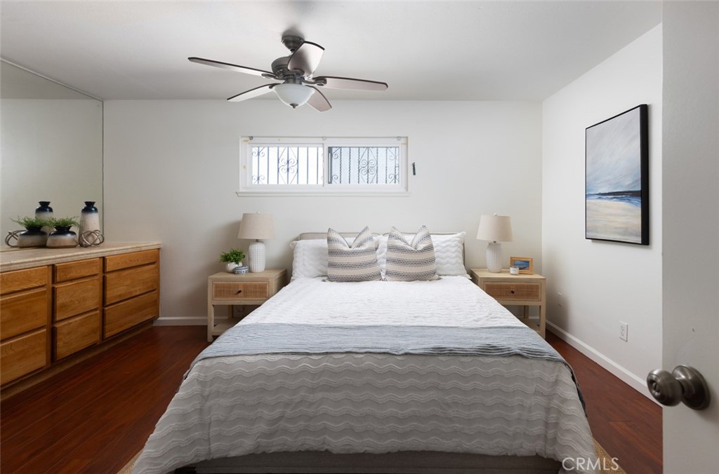 7901 Rhine Drive Huntington Beach, CA 92647 - Photo 11 of 19 a bedroom with a bed and a window
