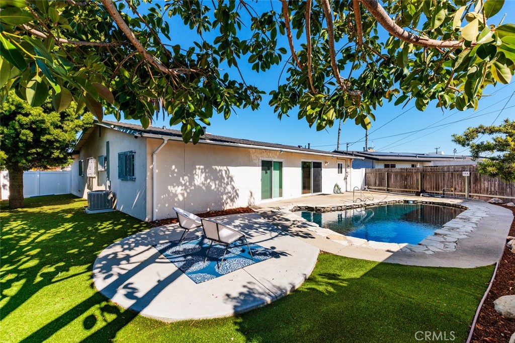 7901 Rhine Drive Huntington Beach, CA 92647 - Photo 16 of 19 a front view of a house with garden