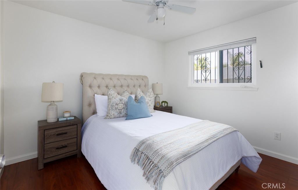 7901 Rhine Drive Huntington Beach, CA 92647 - Photo 9 of 19 a bedroom with a bed and a window