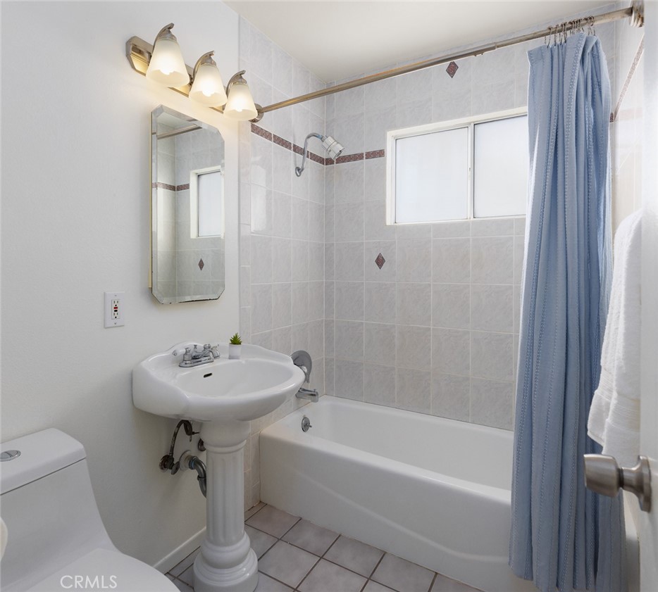 7901 Rhine Drive Huntington Beach, CA 92647 - Photo 10 of 19 a bathroom with a sink a toilet and shower
