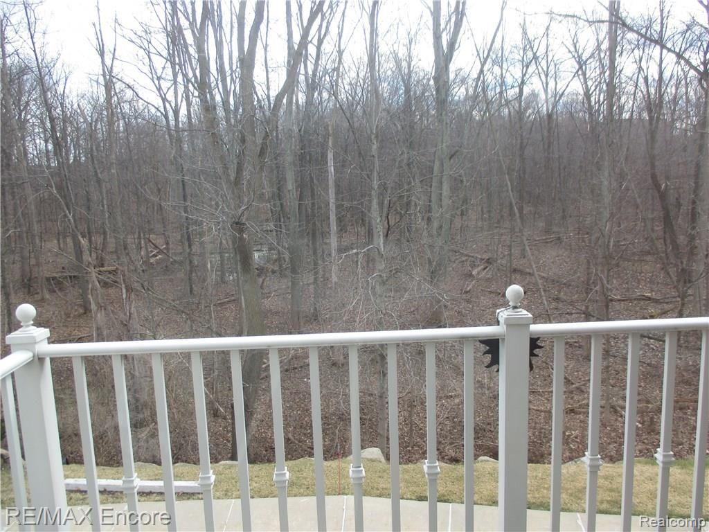 3567 Tremonte Circle, Unit 243 Rochester, MI 48306 - Photo 12 of 23 View of woods from balcony