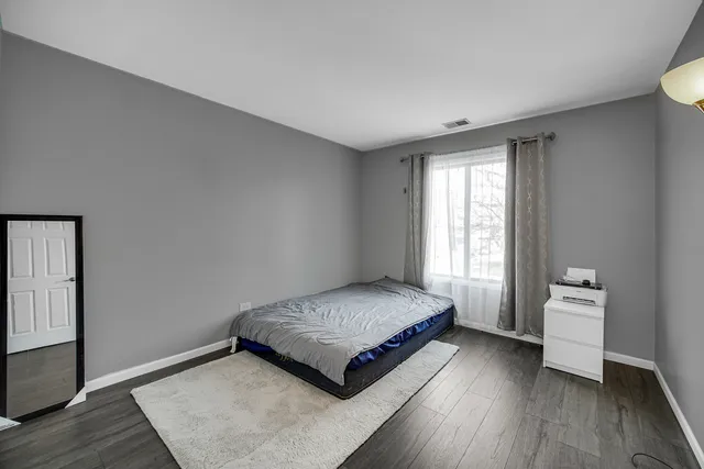 a room with a bed and a window