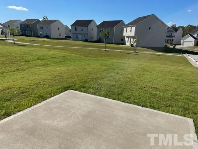 a view of a big yard with a house
