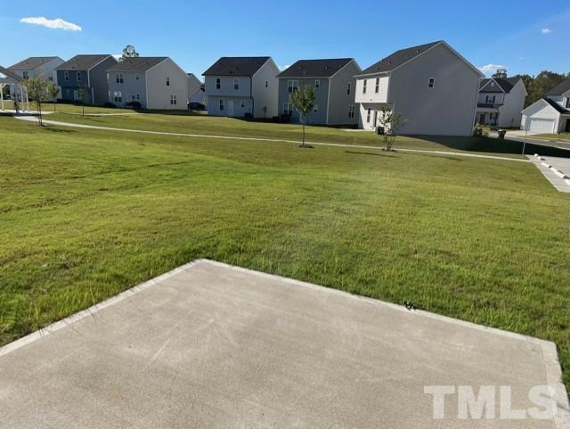 113 Picabo Street Clayton, NC 27527 - Photo 2 of 8 a view of a big yard with a house