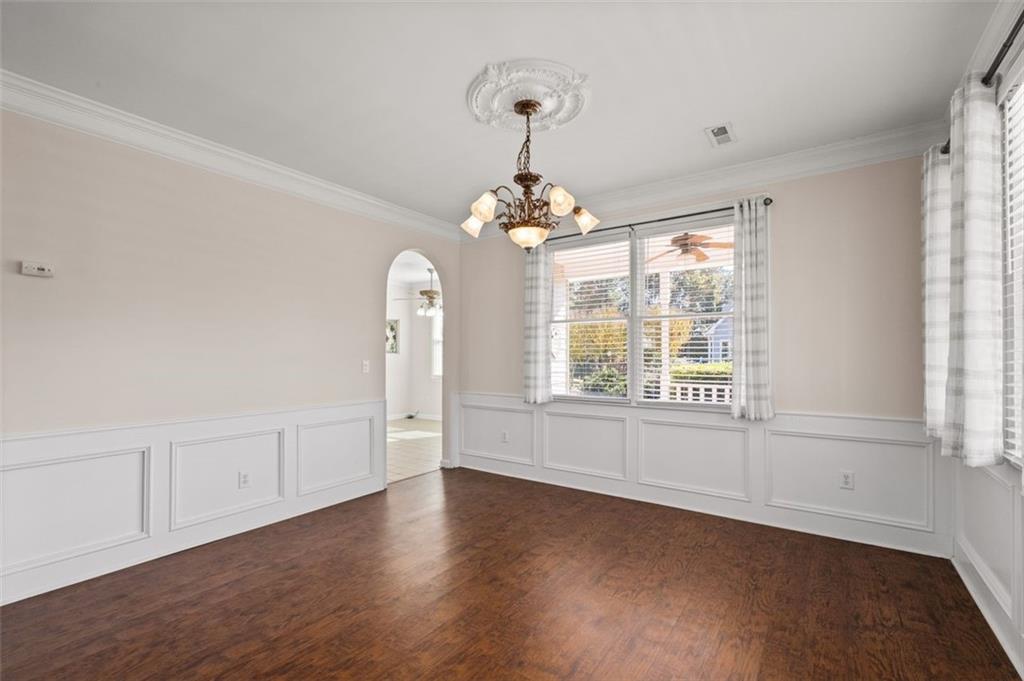 2935 Cobblestone Drive Cumming, GA 30041 - Photo 11 of 53 wooden floor in an empty room with a window