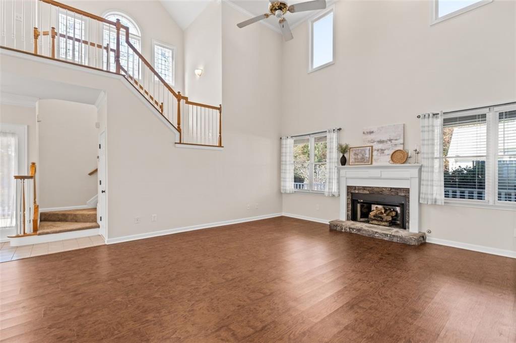2935 Cobblestone Drive Cumming, GA 30041 - Photo 16 of 53 an empty room with windows and fireplace