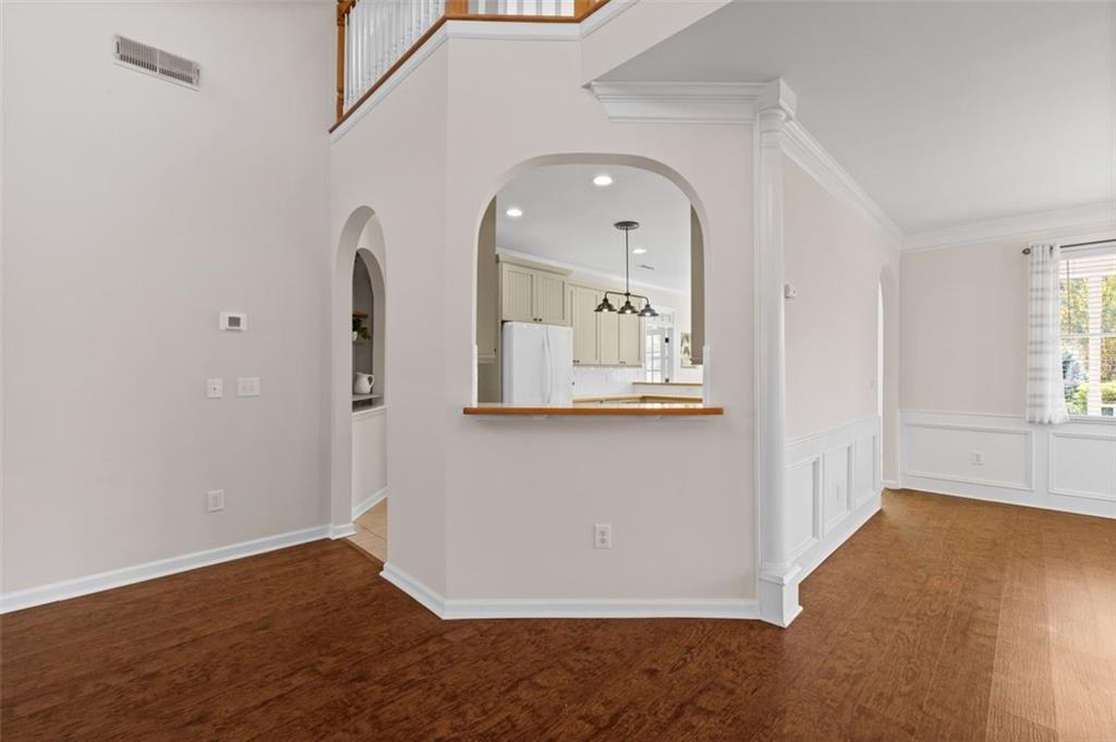 2935 Cobblestone Drive Cumming, GA 30041 - Photo 17 of 53 an empty room with wooden floor and windows