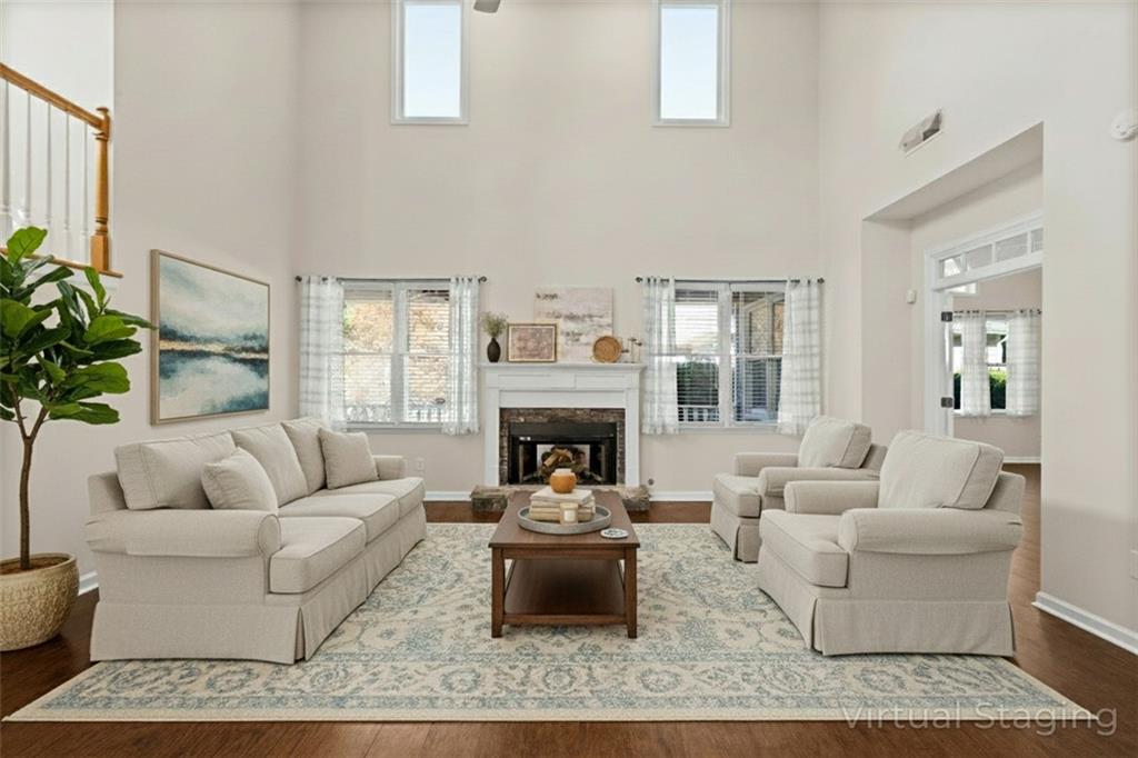 2935 Cobblestone Drive Cumming, GA 30041 - Photo 19 of 53 a living room with furniture and a fireplace
