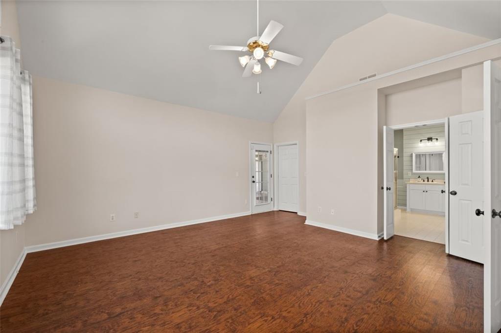 2935 Cobblestone Drive Cumming, GA 30041 - Photo 28 of 53 wooden floor in an empty room with a window