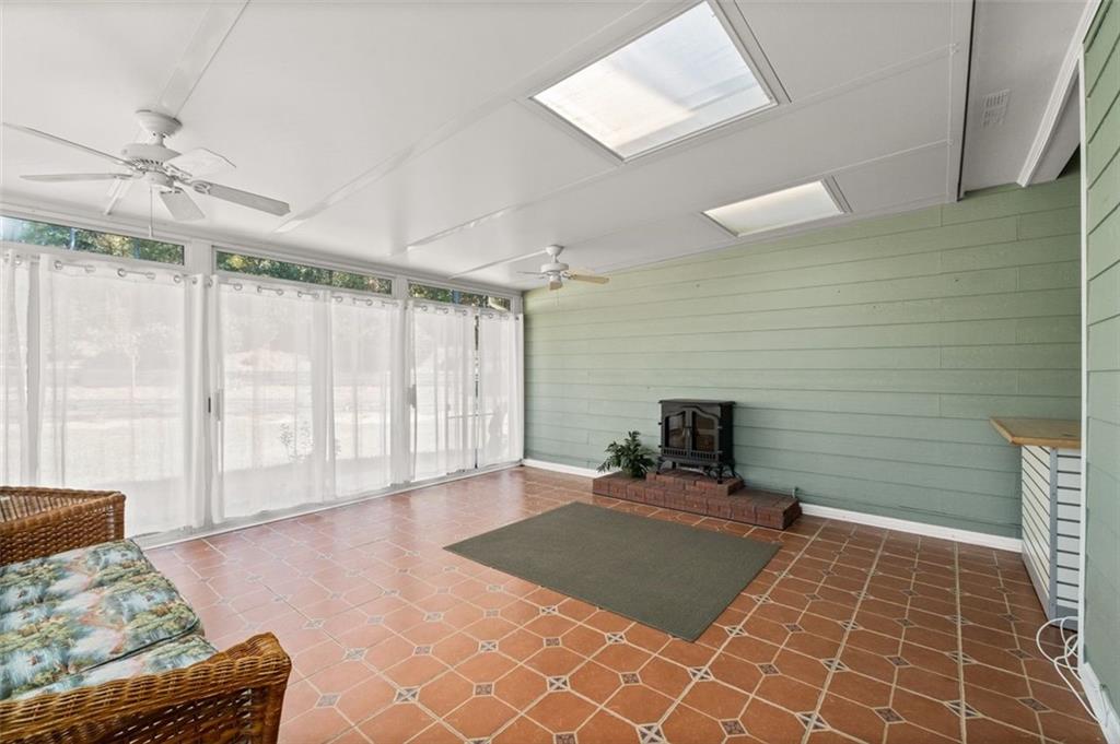 2935 Cobblestone Drive Cumming, GA 30041 - Photo 32 of 53 a view of an empty room with a window and a fireplace