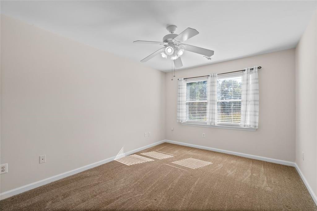 2935 Cobblestone Drive Cumming, GA 30041 - Photo 39 of 53 a view of an empty room with a window