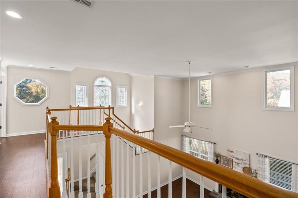 2935 Cobblestone Drive Cumming, GA 30041 - Photo 41 of 53 a view of a hallway with a large window and wooden floor