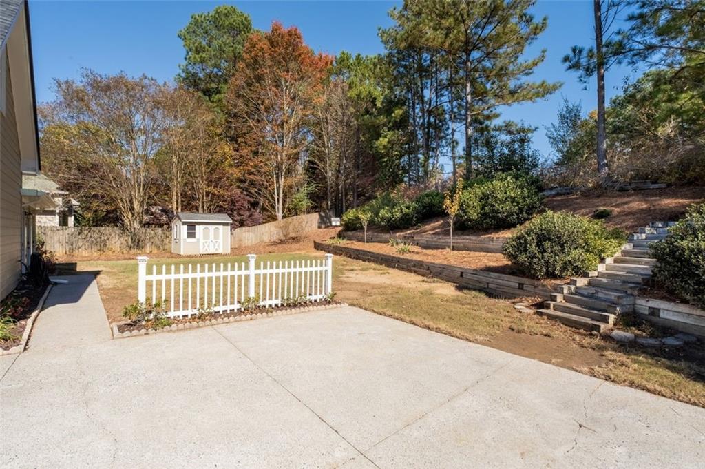 2935 Cobblestone Drive Cumming, GA 30041 - Photo 44 of 53 a view of a house with a outdoor space
