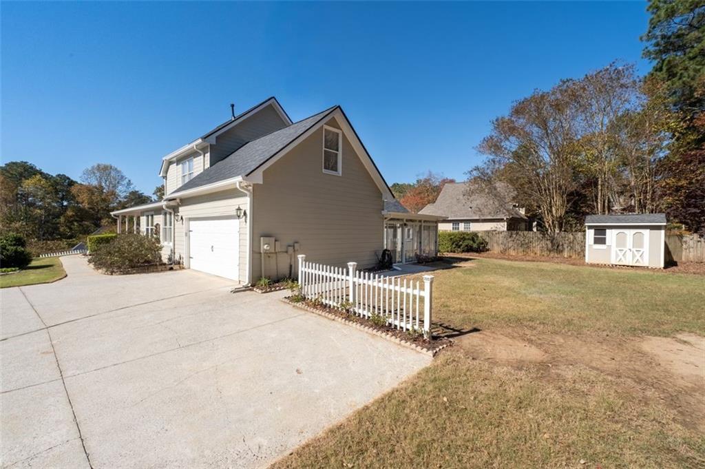 2935 Cobblestone Drive Cumming, GA 30041 - Photo 46 of 53 a front view of a house with garage